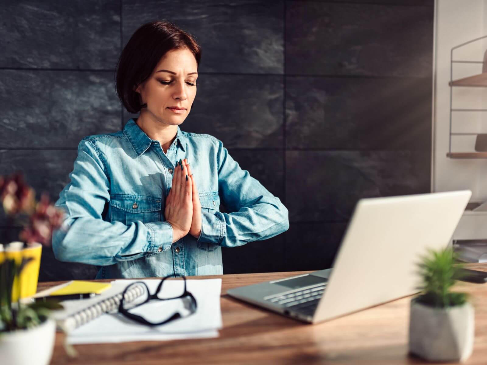 Woman meditating at work