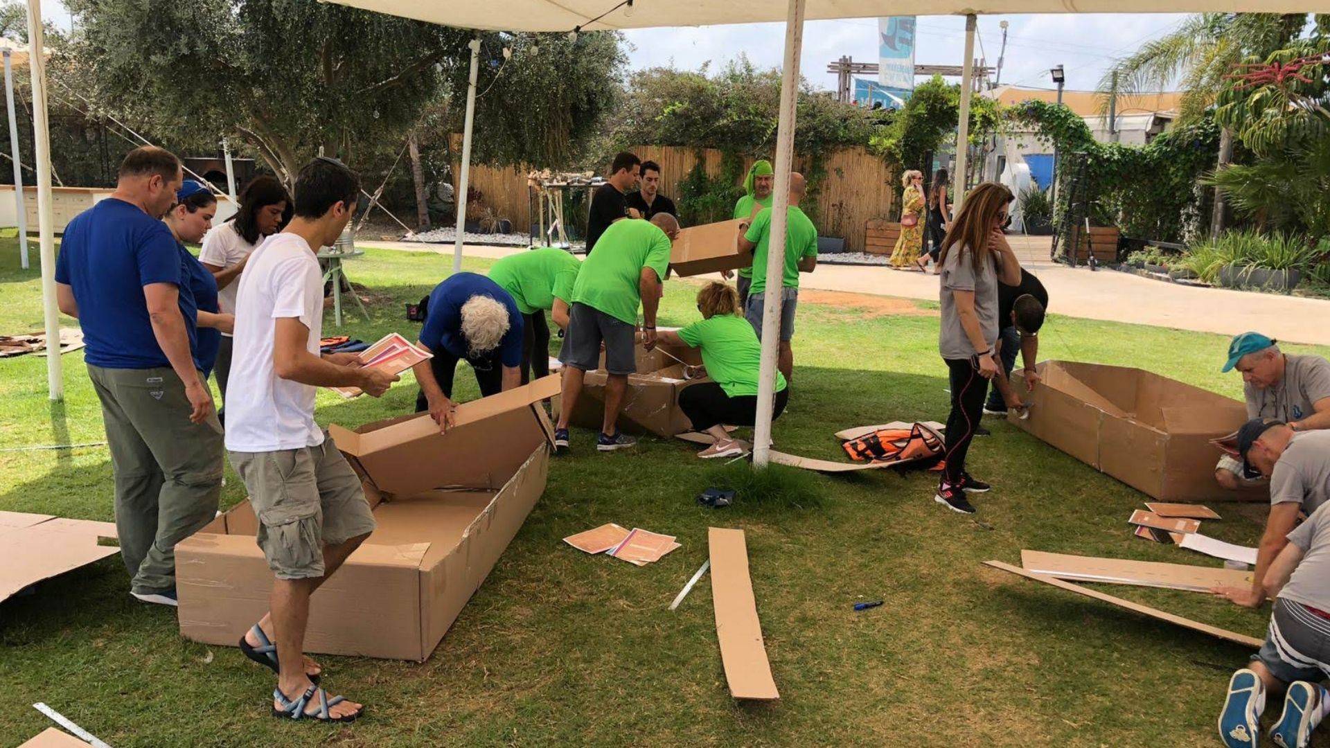 Participants making their boat out of cardboard